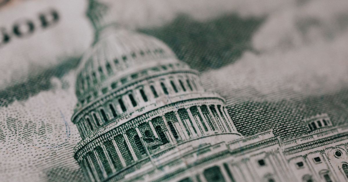 From above of photo of historic Capitol of USA Congress in neoclassical style with columns and dome represented on paper money